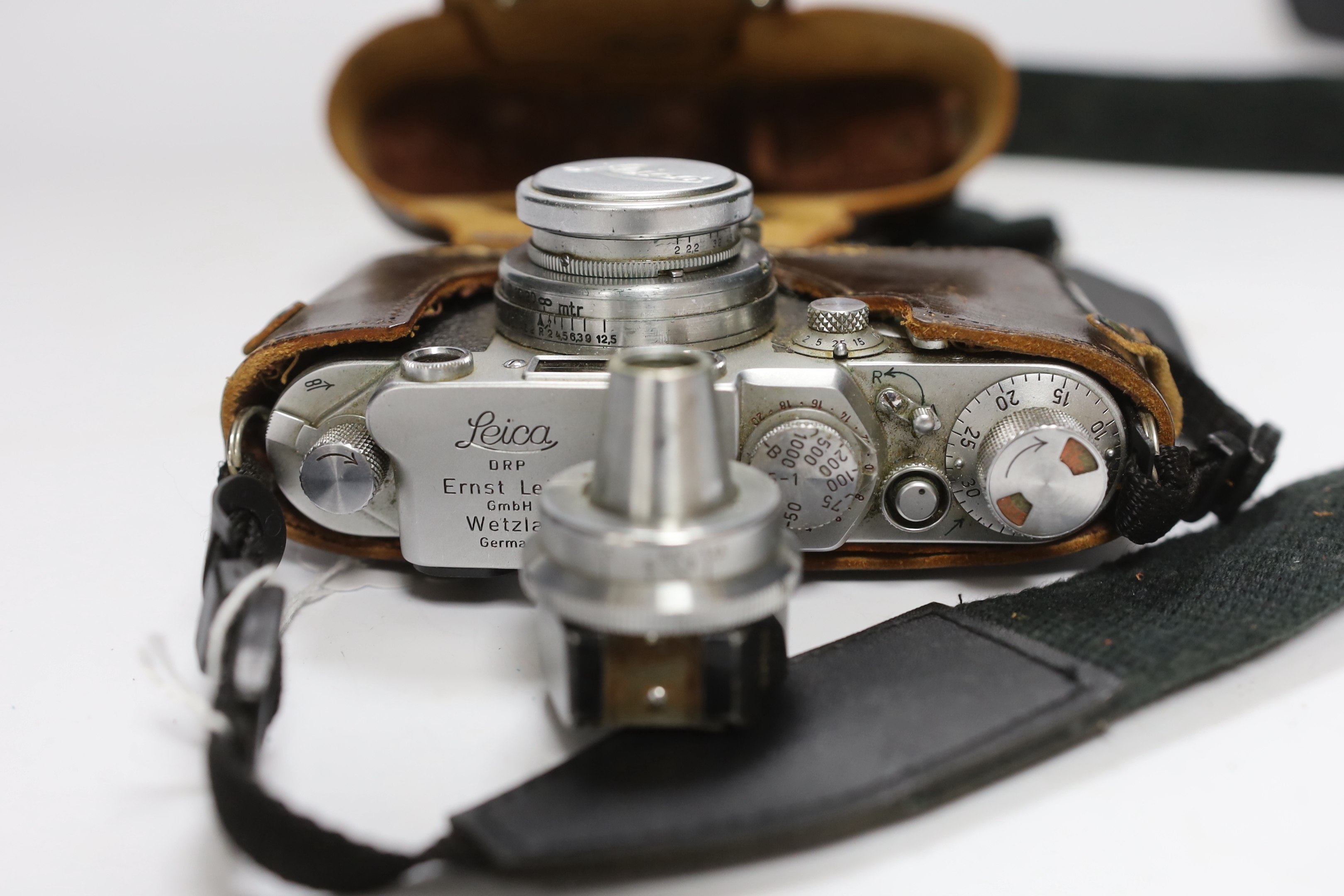 A Leica IIf camera, serial no. 577837, c. 1952-3, with Leitz Vidom viewfinder, Summar f+5cm 1.2 lens, in leather case with replacement strap